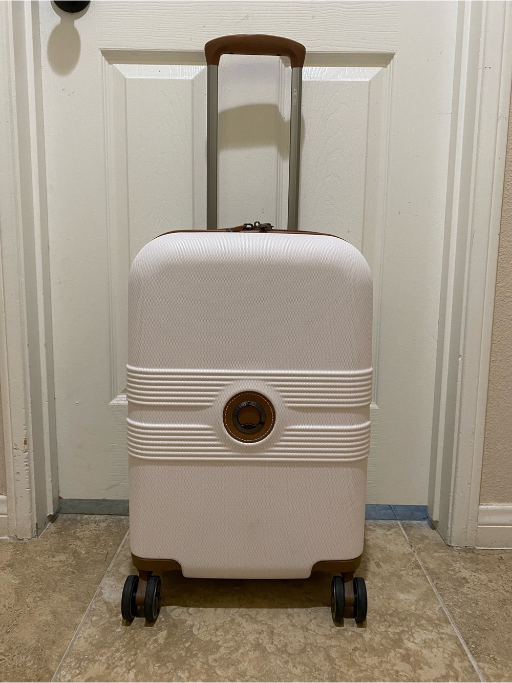 Delsey Paris white Carry-On Spinner Luggage with Tan Accents